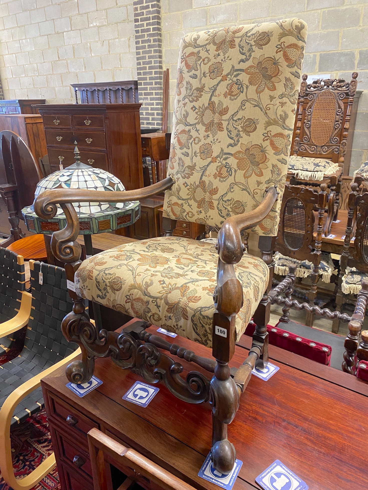 A reproduction Jacobean style mahogany upholstered elbow chair, width 64cm, depth 51cm, height 170cm